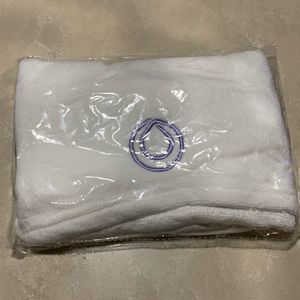 Monat Hair Towel White with purple logo and button closure